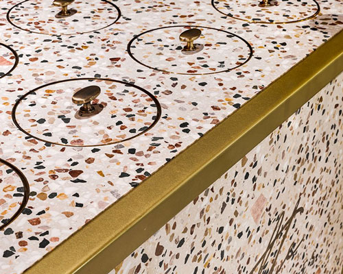 brass details and custom-made terrazzo adorn chocolate boutique in turkey by nēowe