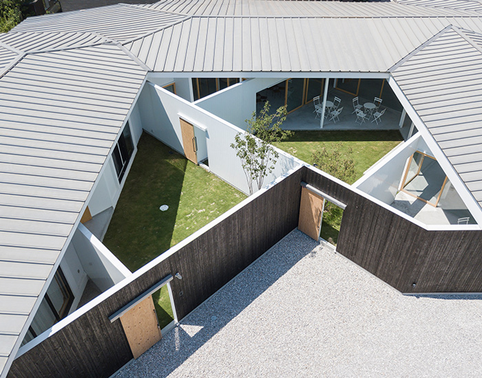 tato architects organizes house and office in japan with angled walls and internal courtyards