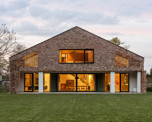 wrzeszcz architekci uses bricks from an old barn to build new house in poland