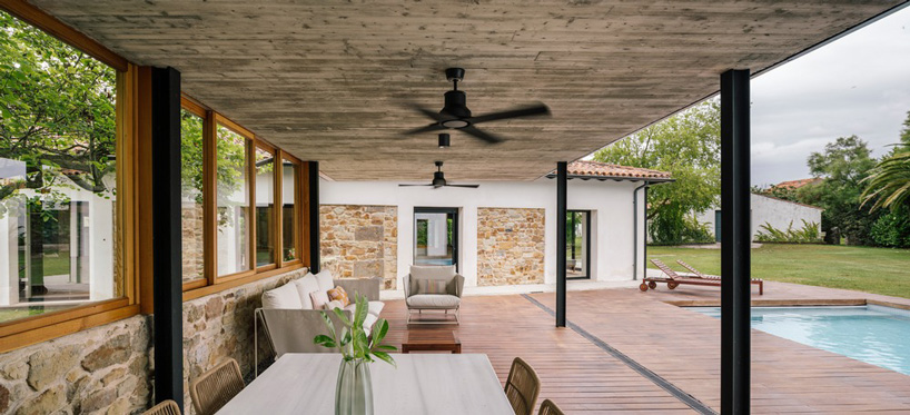 zooco estudio converts former stable into seasonal house in güemes, spain