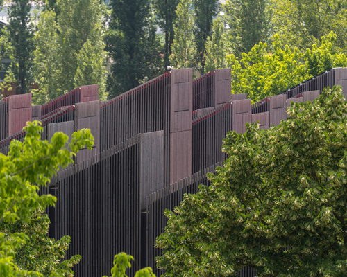 mario cucinella clusters a field of timber chimneys for ARPAE headquarters