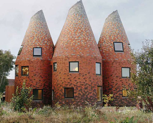 acme creates a contemporary oast house amid the rolling landscape of kent, england