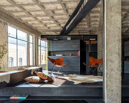 exposed concrete columns furnish aquiles jarrín's 'forest' apartment renovation in quito