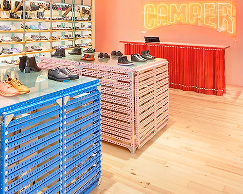 oficina penadés builds malaga's camper store with perforated metal profiles
