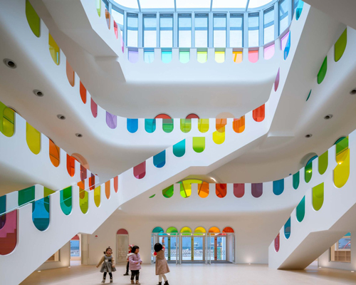 colorful glass decorates this kaleidoscopic kindergarten in china by SAKO architects