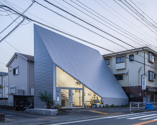 DOG completes 8.5 house in japan with steep sloping roof and diagonal exhibition wall
