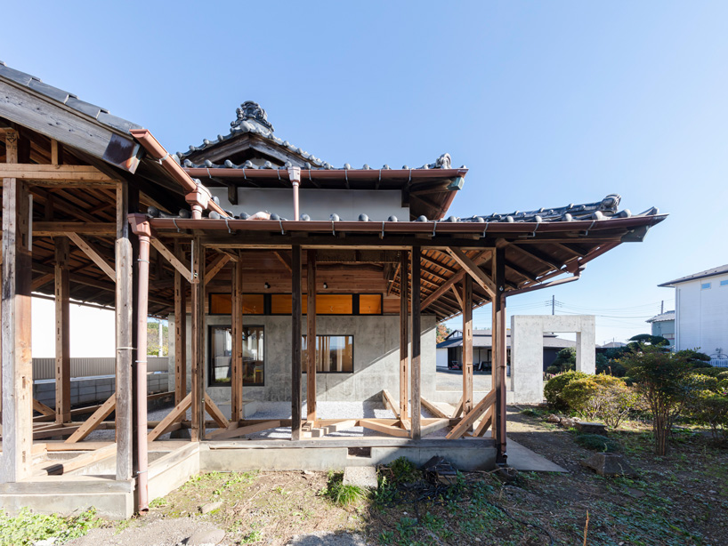 DOG scales down house topped with traditional tile roof in kawagoe, japan