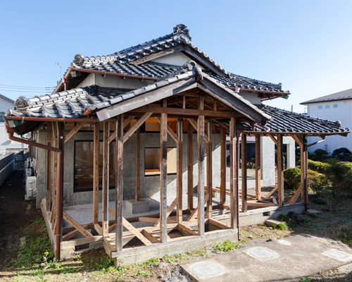 DOG scales down house topped with traditional tile roof in kawagoe, japan