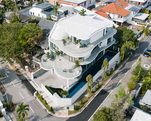 curved geometries define EHKA studio's sculptural 'jalan seaview' house in singapore
