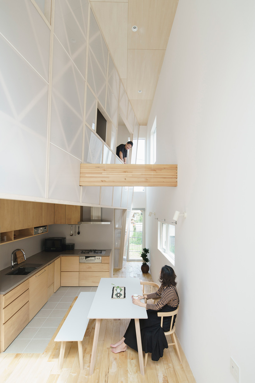 eri sumitomo architects + enjoyworks insert acrylic 'curtain' within house in hayama, japan