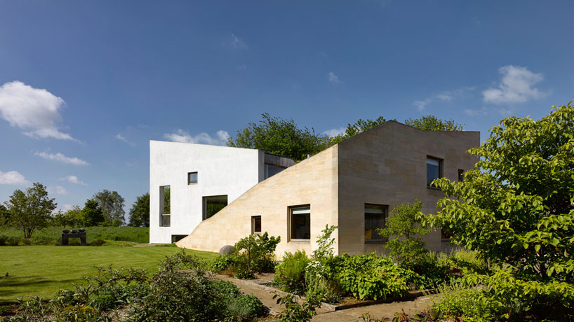 featherstone young builds a house with folding green roofs in rural england designboom