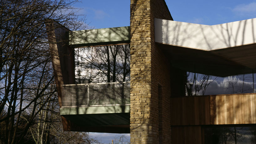 featherstone young builds a house with folding green roofs in rural england designboom