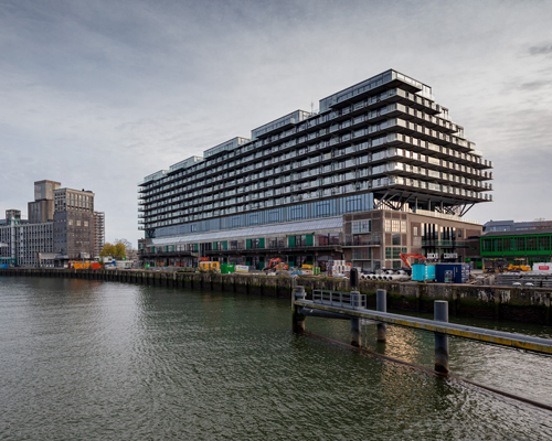 fenix I by mei architects floats atop heritage warehouse on the rotterdam waterfront