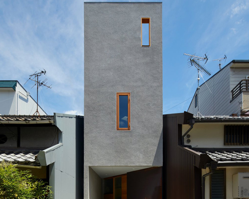 fujiwaramuro architects' narrow house in tezukayama, japan, is built around a 'shelf-staircase'