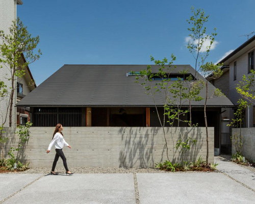 gabled roof with extended eaves tops hearth architects' hikone house in japan