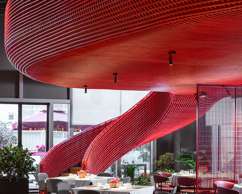 red rattan metal wraps around a restaurant in chengdu designed by IN • X