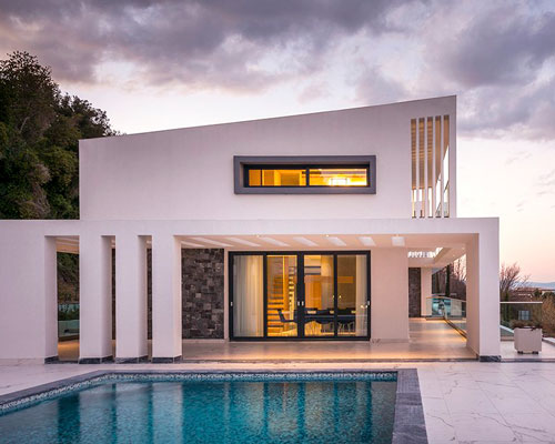 officetwentyfivearchitects designs two idyllic beachside villas in greece
