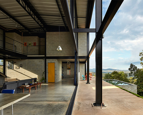 'casa galpao' by marcos franchini in brazil combines steel framing and exposed concrete