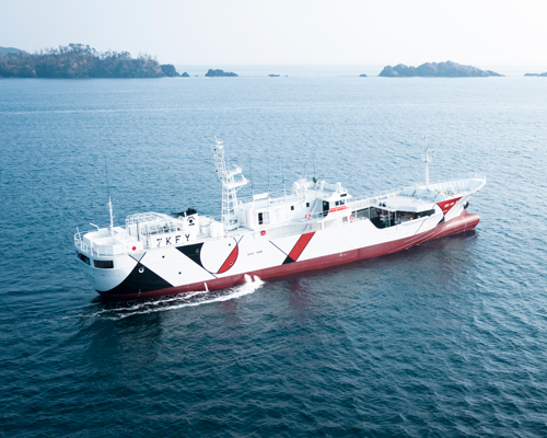 nendo transforms fishing vessel with graphic patterning to recall life ashore