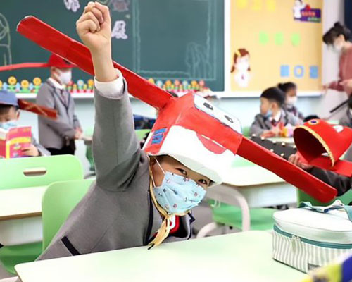 schoolchildren in china make creative social-distancing hats inspired by ancient headwear