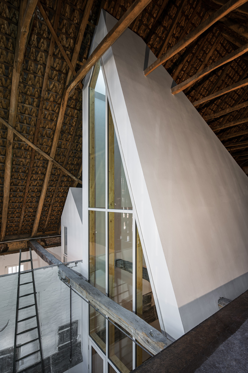 sigurd larsen sets dortmannhof house inside 200-year-old barn in western germany