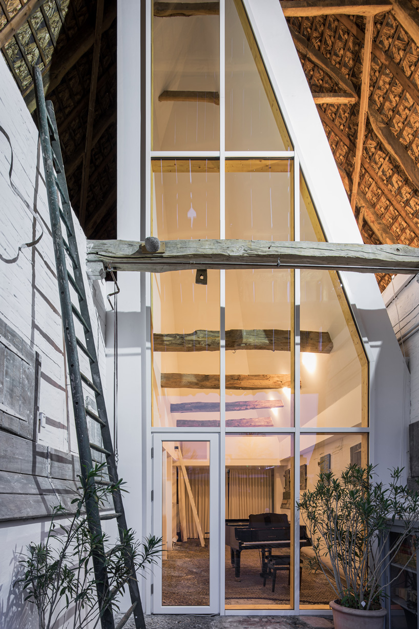 sigurd larsen sets dortmannhof house inside 200-year-old barn in western germany