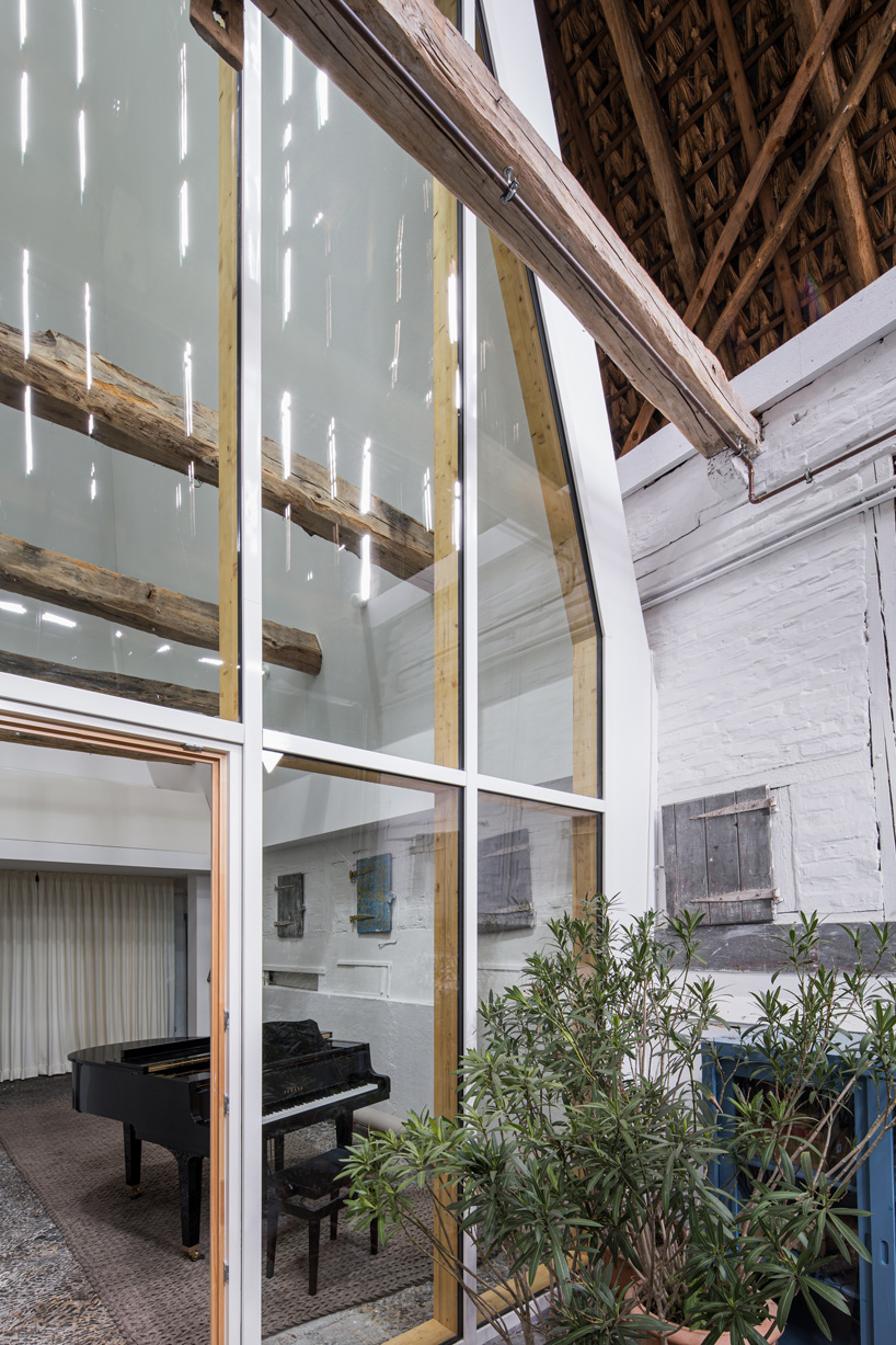 sigurd larsen sets dortmannhof house inside 200-year-old barn in western germany