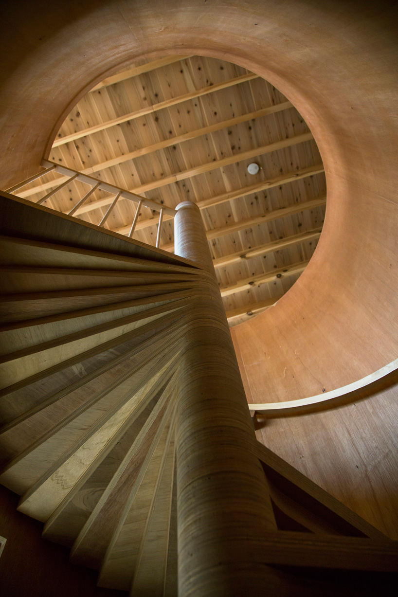 tomoaki uno architects places concrete + wood residence on steep slope in japan