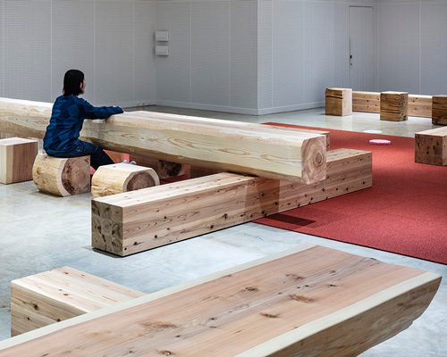 TORAFU architects renovates museum gallery with cedar logs as benches and tables in japan