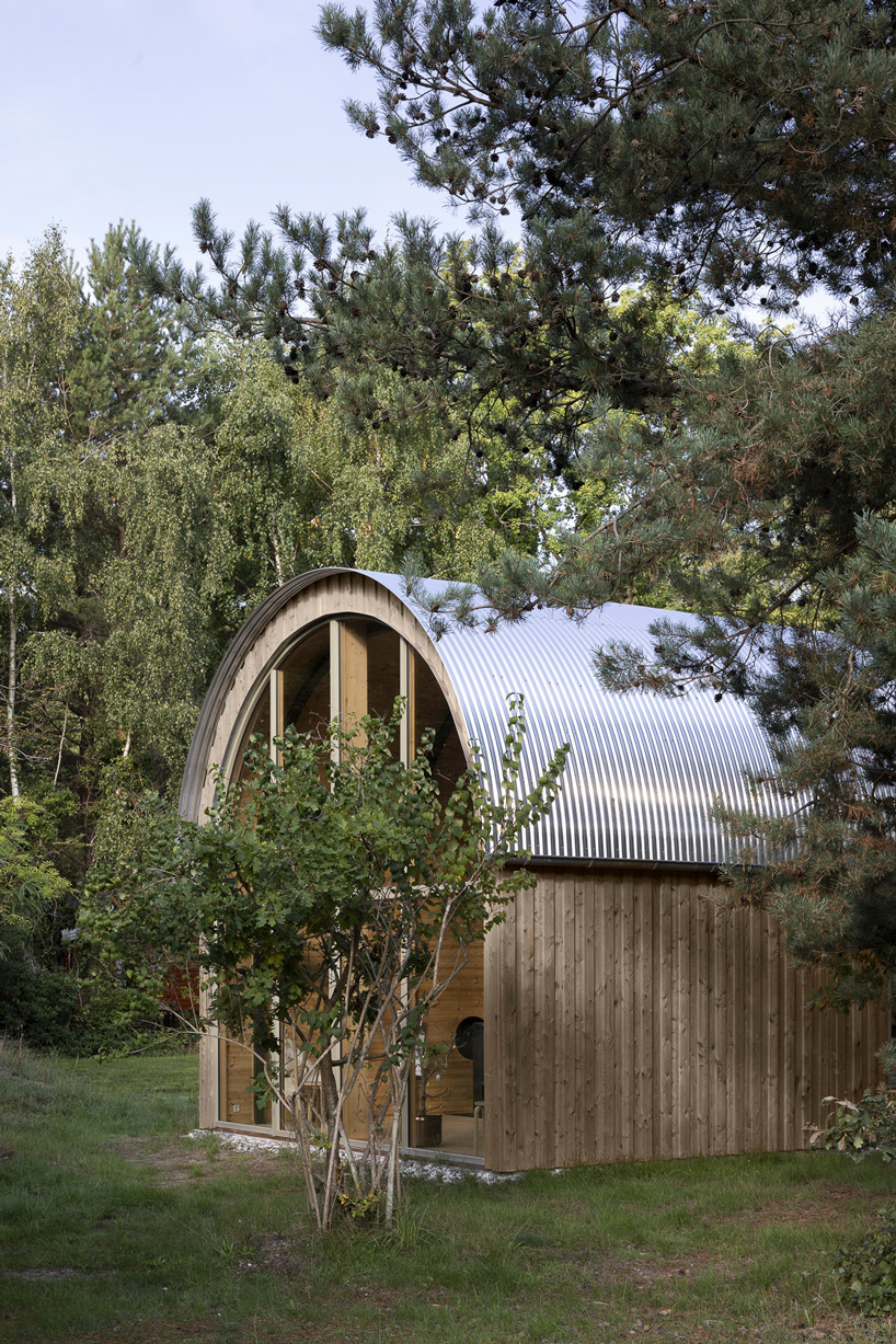 valbæk brørup architects tops wooden house in denmark with vaulted steel roof