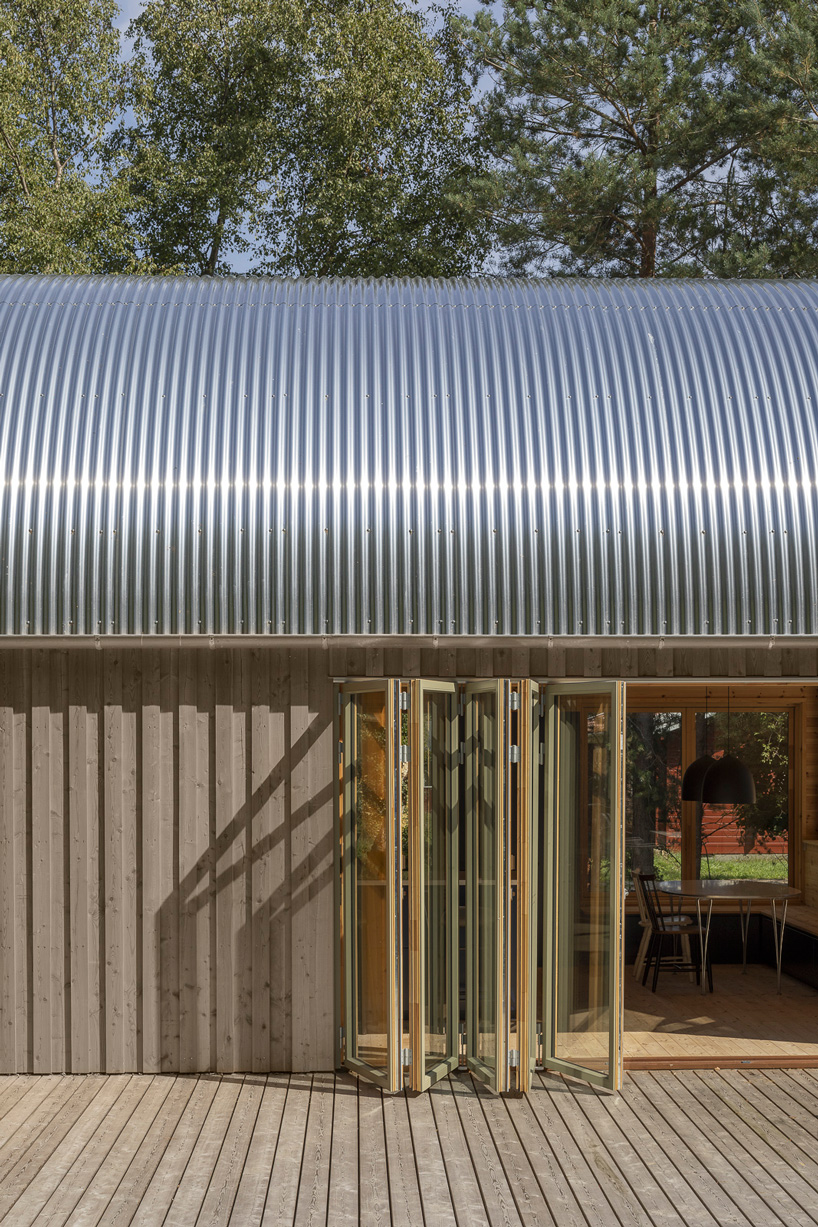 valbæk brørup architects tops wooden house in denmark with vaulted steel roof