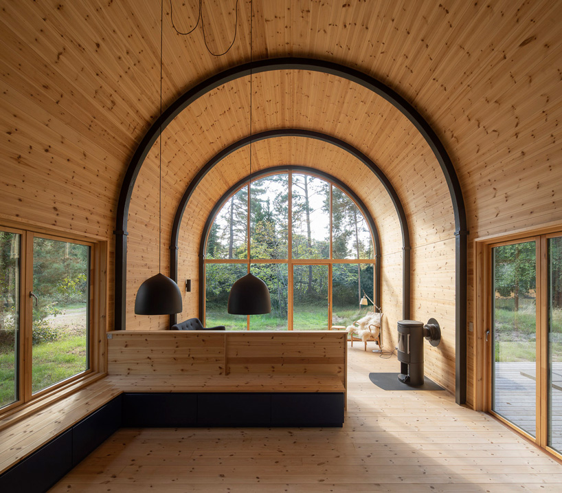valbæk brørup architects tops wooden house in denmark with vaulted steel roof - 2