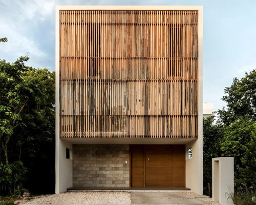 warm architects applies tropical wood in ‘ciruelo 7’ house in cancún, mexico