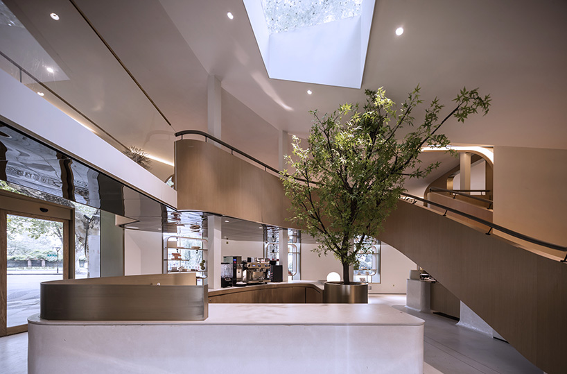 WJ design sets phoenix tree inside anshuka pastry shop in hangzhou, china