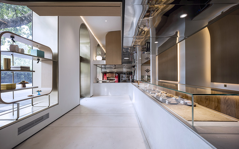 WJ design sets phoenix tree inside anshuka pastry shop in hangzhou, china