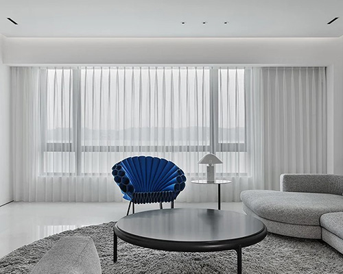 AD ARCHITECTURE adds theatrical elements within minimal apartment interior in china