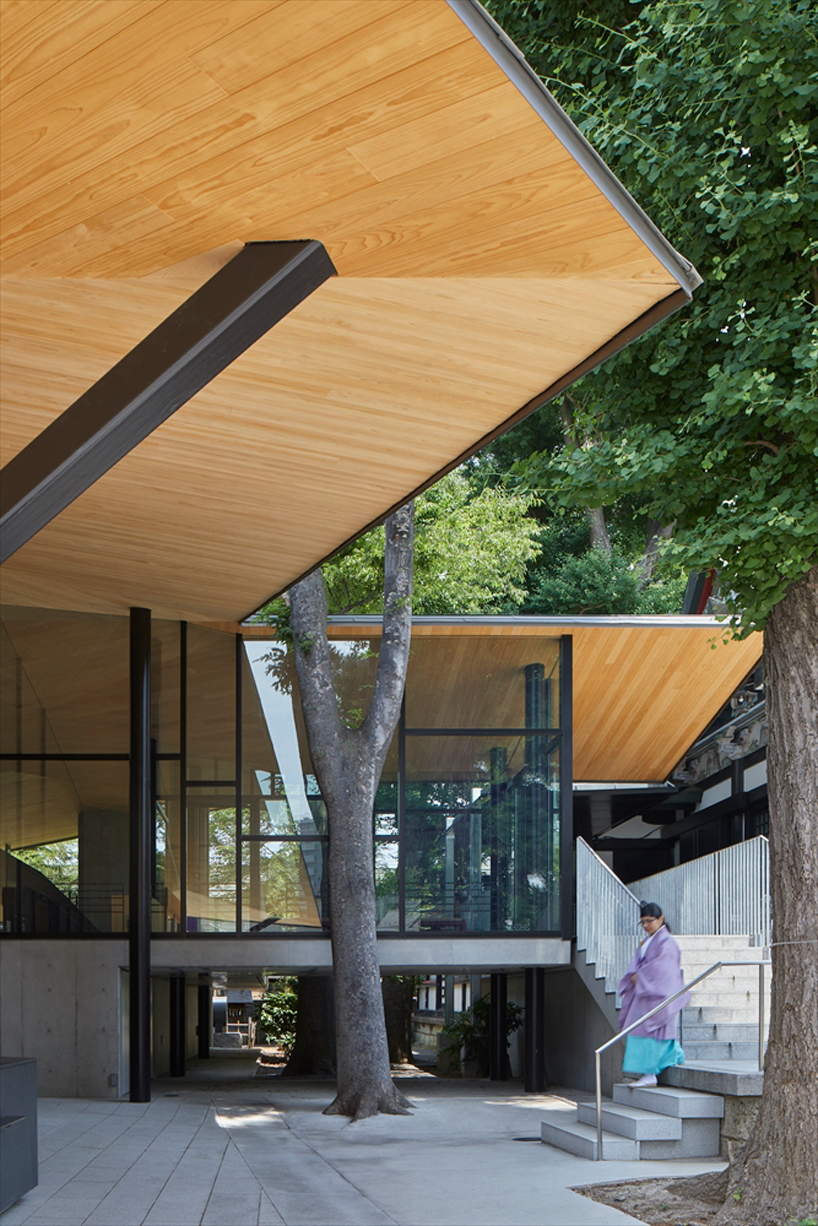 asai architects tops office building of tokyo's kameari katori shrine with folded-plate roof