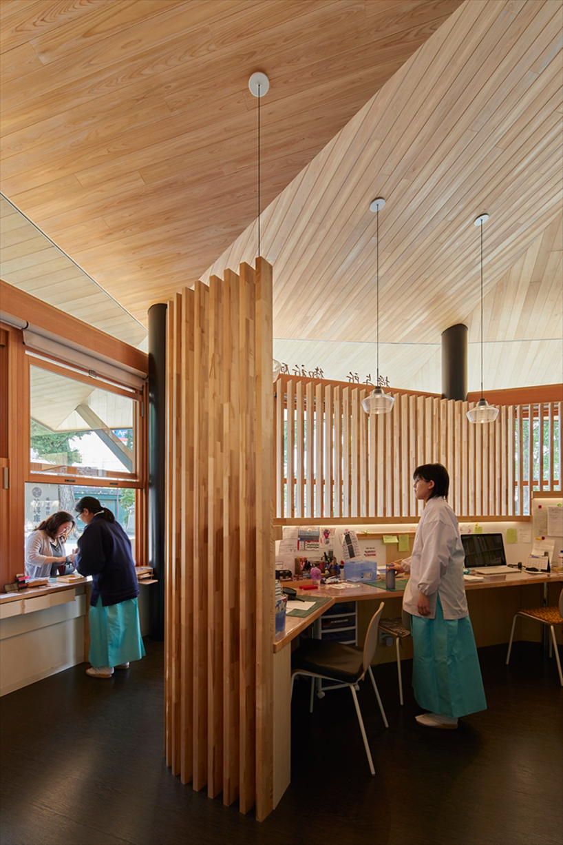 asai architects tops office building of tokyo's kameari katori shrine with folded-plate roof