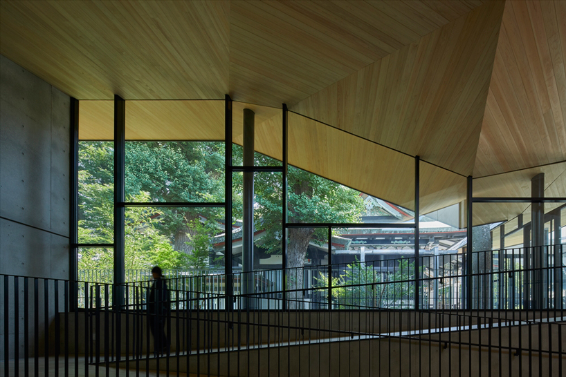 asai architects tops office building of tokyo's kameari katori shrine with folded-plate roof