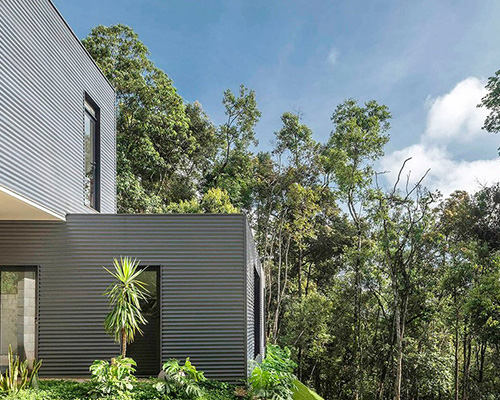 bernardo horta + meius arquitetura build prefab house within mountainous landscape in brazil