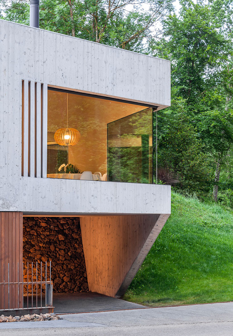 arnau estudi d'arquitectura embeds the 'forest stone' house into a sloped site in spain designboom