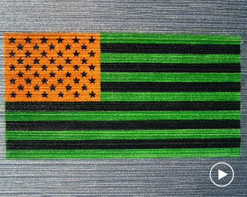 HOTTEA's 'perspective' yarn installation references jasper johns' flag painting