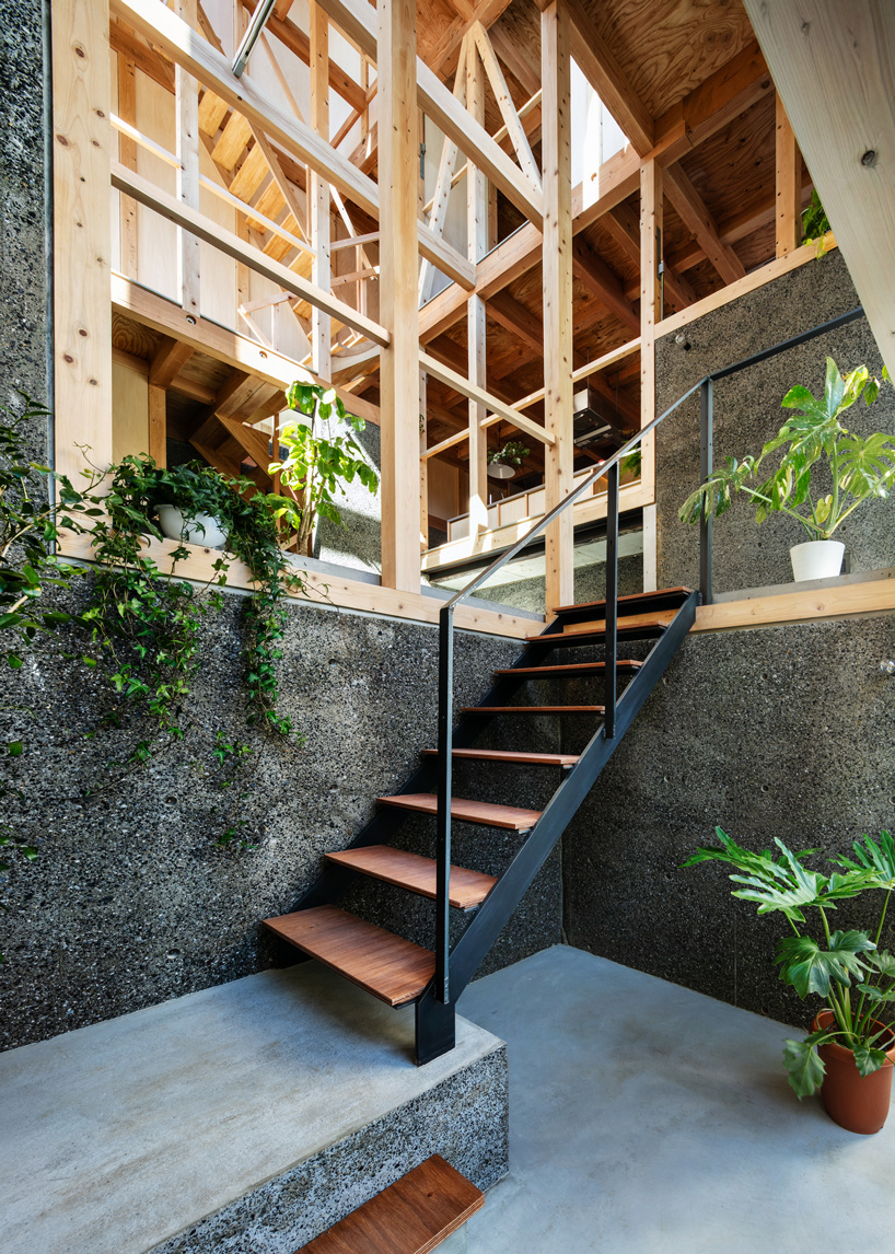 kiyoaki takeda's timber house with five retaining walls in tokyo merges nature with artefact