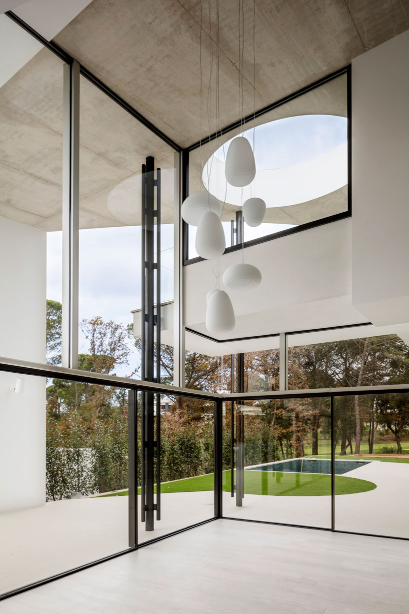 the wedged volume of lagula's 'gruyere house' optimizes both privacy and views in girona designboom