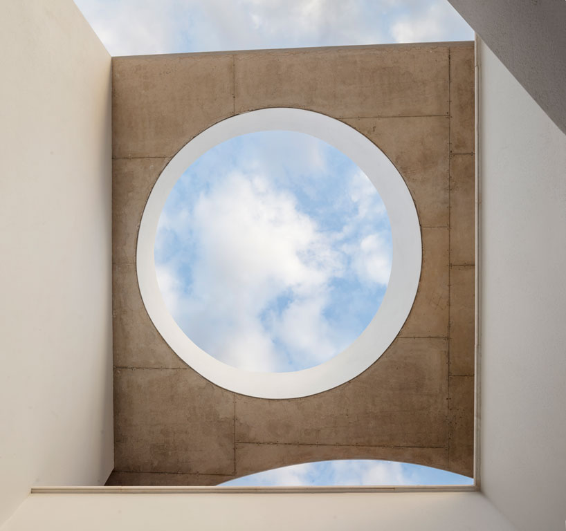 the wedged volume of lagula's 'gruyere house' optimizes both privacy and views in girona designboom