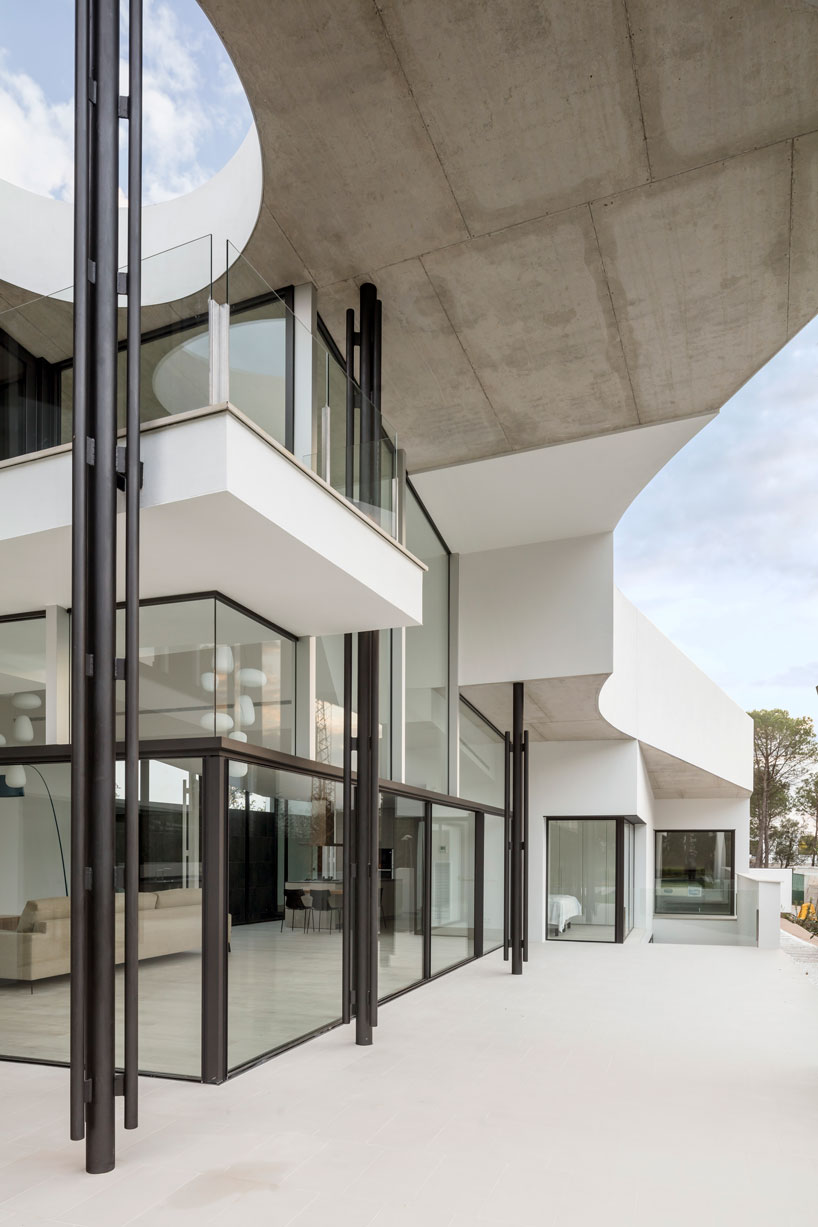 the wedged volume of lagula's 'gruyere house' optimizes both privacy and views in girona designboom