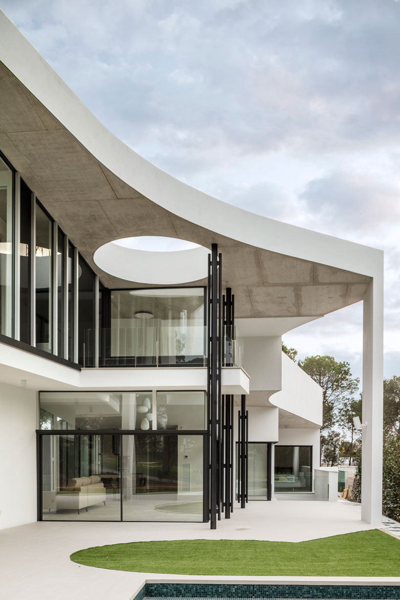 the wedged volume of lagula's 'gruyere house' optimizes both privacy and views in girona designboom