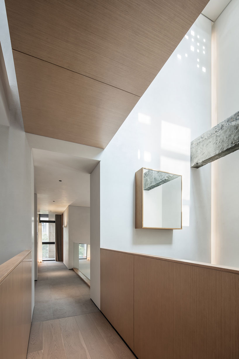 liang architecture inserts a light-filled atrium into apartment renovation in china designboom