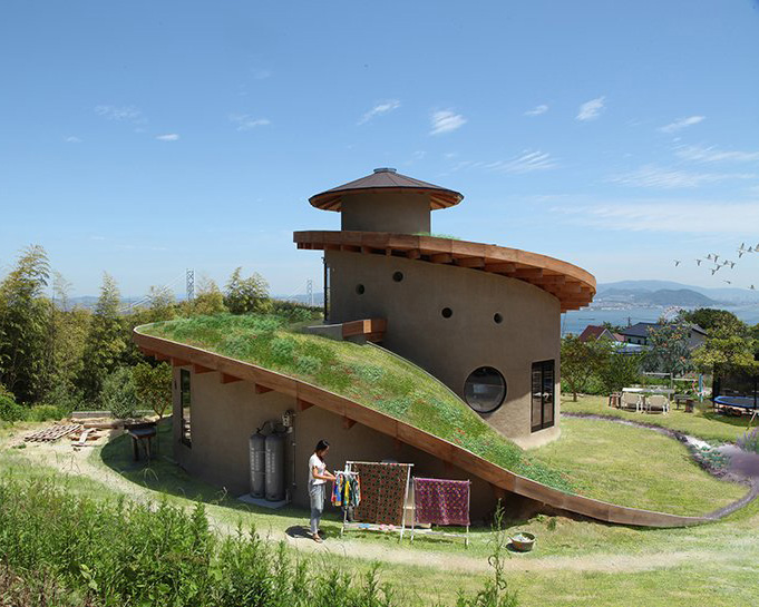 ryuichi ashizawa sets spiral family house with roof garden on awaji island in japan