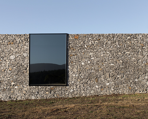 room 11 offers relief from tasmania's blinding sunlight with all-black interiors
